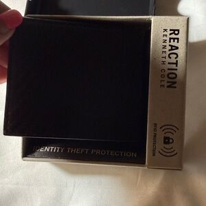 NWT - Men’s Kenneth Cole Reaction Black Wallet with RFID Protection.